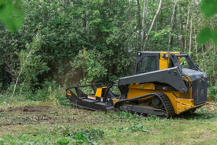 mower attachment on skid steer clearing brush