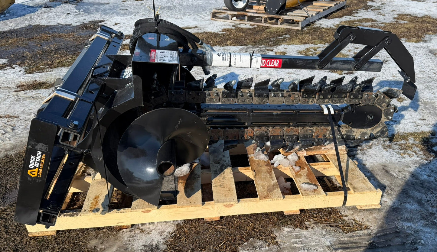 Heavy-duty attachment on a wooden pallet in an outdoor setting with snow and dirt.