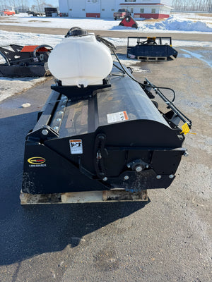 Black snow plow attachment on a vehicle in an outdoor setting with snow on the ground.