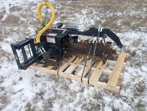Heavy-duty agricultural tool on a wooden pallet in a snowy field