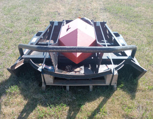 A used 72 inch Skid Pro Brush Mower with visible signs of wear and dirt, parked on grass.