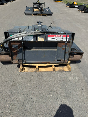 Large industrial attachment on a pallet in an outdoor setting