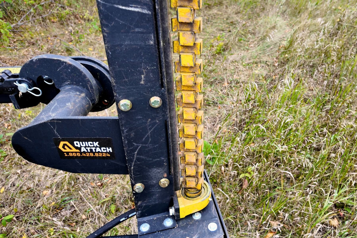 Close-up of the Junior Limb Cutter’s yellow cutting teeth and black mounting bracket.