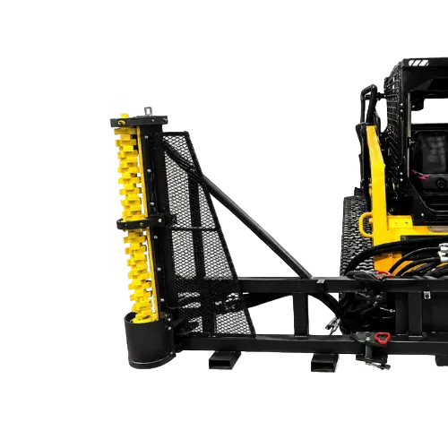 A heavy-duty industrial attachment on a skid steer loader-mounted frame system, featuring a black steel mesh guard, support beams, and a prominent yellow vertical screw or roller assembly.