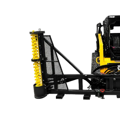 A heavy-duty industrial attachment on a skid steer loader-mounted frame system, featuring a black steel mesh guard, support beams, and a prominent yellow vertical screw or roller assembly.