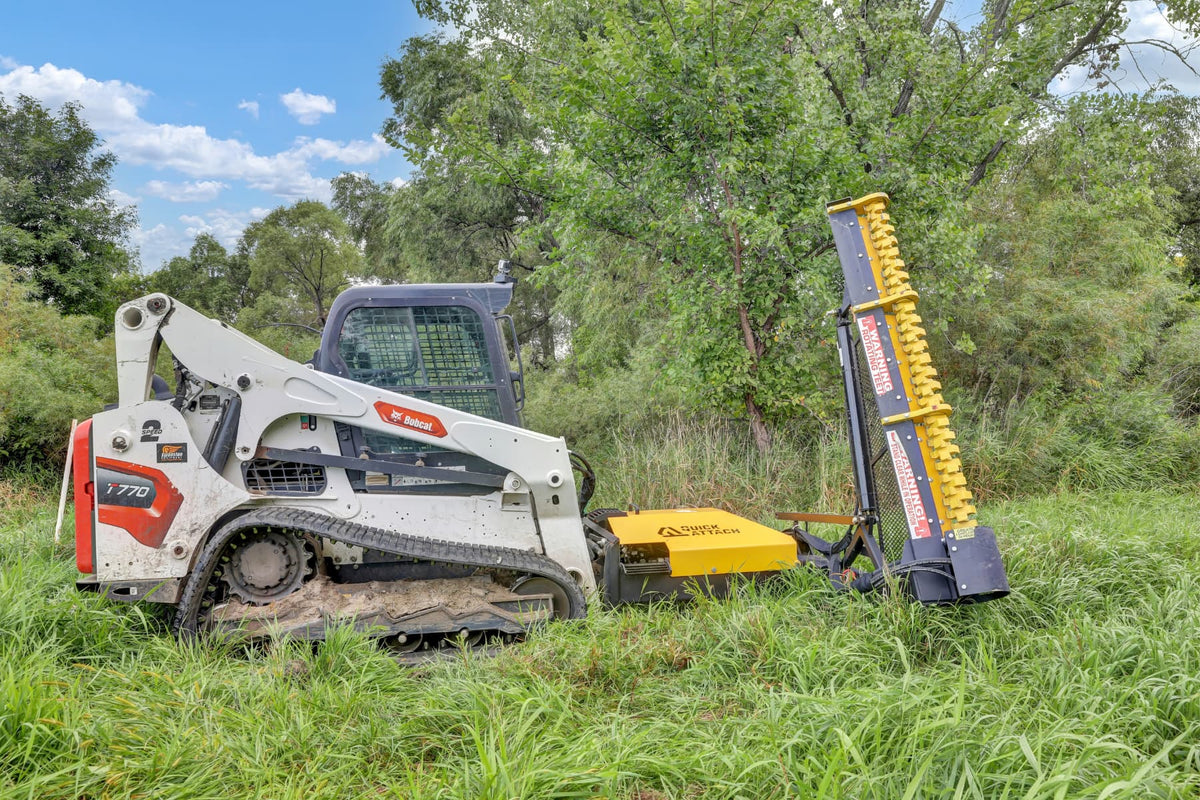 Side view of a skid steer with the Limb Cutter 6 attachment raised beside overgrown vegetation.