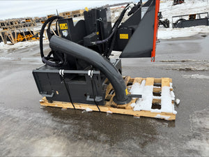Heavy-duty attachment on a pallet with a construction site in the background