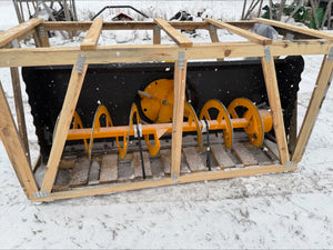 Snow removal machine with wooden frame on a snowy ground