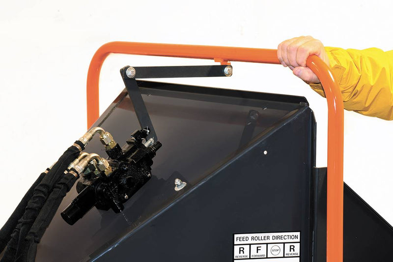 Safety shut-off grab bar controls the hydraulic feed roller