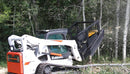 Skid Steer Mulcher with Unique slanted push bar prevents unwanted trees from hanging on the deck after cutting